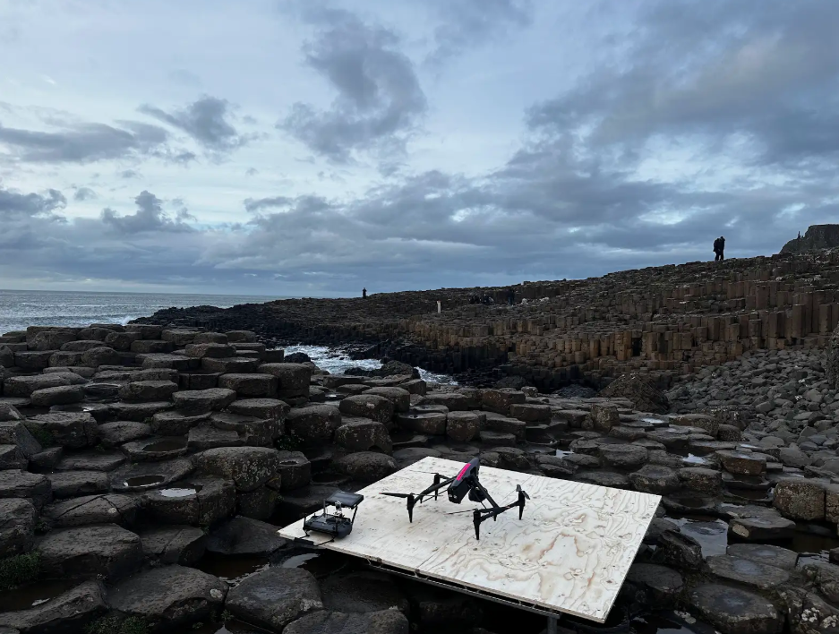 Aerial cinematography with drones on a platform at Giant’s Causeway, ready for a TV or film production shoot.